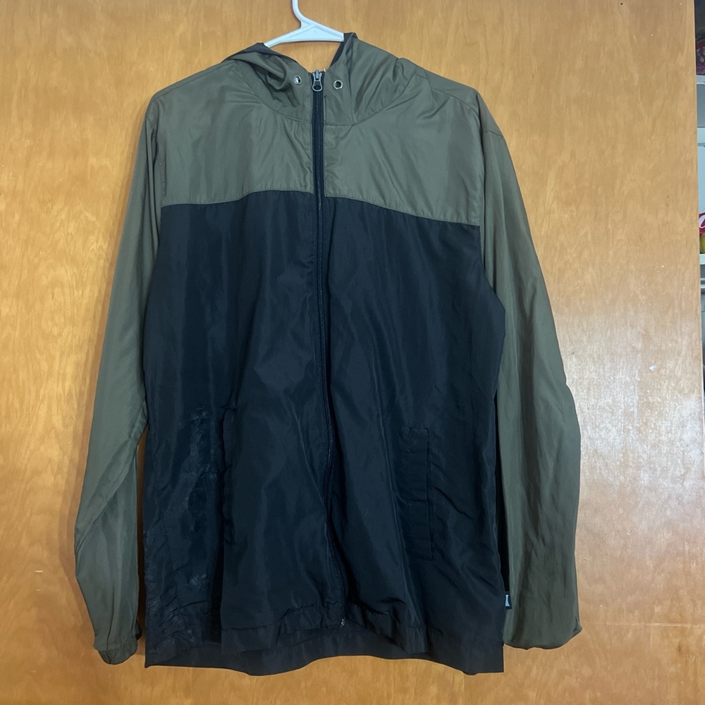 Green and black men’s windbreaker jacket.